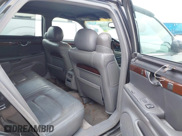 2001 Cadillac DeVille DHS z VIN 1G6KE57YX1U190955, wystawiony jako IAAI lot #41941668 z przebiegiem 191 040 mil mil oraz . Historia ofert i sprzedaży dostępna na DreamBid. Obrazek 8.