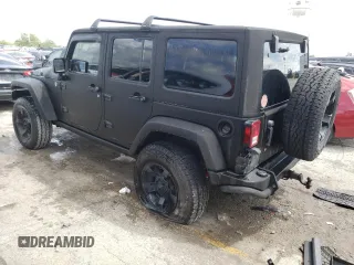 2013 Jeep Wrangler Unlimited Rubicon 10th Anniversary with VIN 1C4HJWFGXDL543660, listed as a Copart auction lot 61462104 with 115,897 mi miles and Salvage title. Bid and sale history available at DreamBid. Image 2.
