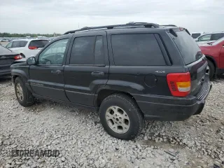 2000 Jeep Grand Cherokee Laredo z VIN 1J4GW48S1YC326453, wystawiony jako Copart lot #57332675 z przebiegiem 290 059 mil mil oraz Czysty tytuł • Clean title. Historia ofert i sprzedaży dostępna na DreamBid. Obrazek 2.
