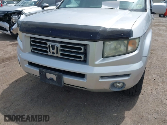 2006 Honda Ridgeline RTL with VIN 2HJYK16566H550339, listed as a IAAI auction lot 42223323 with 240,372 mi miles and . Bid and sale history available at DreamBid. Image 6.