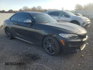 2016 BMW 2 Series M235i xDrive with VIN WBA1J9C57GV371986, listed as a Copart auction lot 77871604 with 0 mi miles and Salvage Title. Bid and sale history available at carsss.com. Image 4.