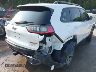 2021 Jeep Cherokee Trailhawk with VIN 1C4PJMBX4MD124980, listed as a IAAI auction lot 42372537 with 55,667 mi miles and . Bid and sale history available at DreamBid. Image 6.