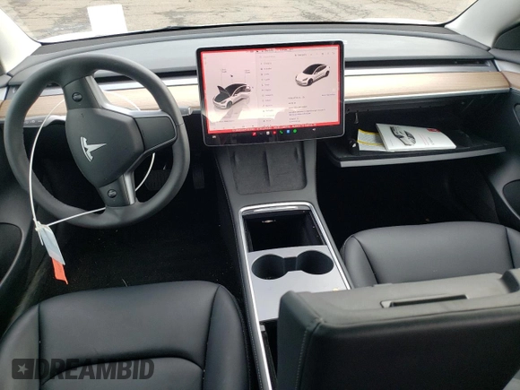 2023 Tesla Model 3 with VIN 5YJ3E1EA6PF563331, listed as a Copart auction lot 61124715 with 26,198 mi miles and Salvage title. Bid and sale history available at DreamBid. Image 8.