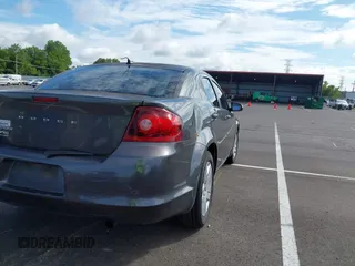 2014 Dodge Avenger SE with VIN 1C3CDZAB3EN219717, listed as a IAAI auction lot 42737543 with 157,362 mi miles and . Bid and sale history available at DreamBid. Image 4.