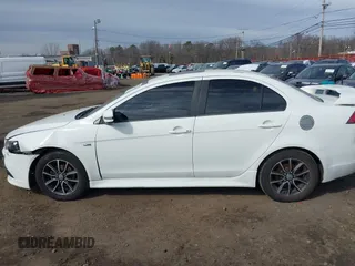 2015 Mitsubishi Lancer SE with VIN JA32V2FW9FU025402, listed as a IAAI auction lot 41646407 with 67,201 mi miles. Bid and sale history available at carsss.com. Image 14.