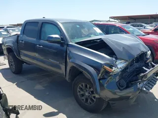 2022 Toyota Tacoma SR with VIN 3TMCZ5AN8NM498933, listed as a IAAI auction lot 42004315 with 56,469 mi miles and . Bid and sale history available at DreamBid. Image 1.