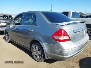 2007 Nissan Versa 1.8 SL with VIN 3N1BC11E37L432291, listed as a IAAI auction lot 41357144 with 136,039 mi miles. Bid and sale history available at carsss.com. Image 3.