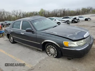 2001 Lincoln Town Car Signature with VIN 1LNHM82W11Y683915, listed as a Copart auction lot 50395865 with Not provided miles and Non repairable. Bid and sale history available at DreamBid. Image 4.