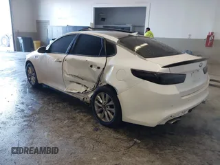 2016 Kia Optima SX Turbo with VIN 5XXGW4L23GG016526, listed as a IAAI auction lot 41428139 with 112,603 mi miles and . Bid and sale history available at carsss.com. Image 3.
