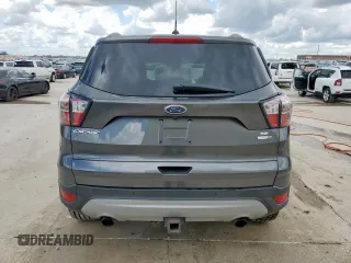 2017 Ford Escape SE z VIN 1FMCU9G91HUE17654, wystawiony jako Copart lot #56173175 z przebiegiem 97 678 mil mil oraz Czysty tytuł • Clean title. Historia ofert i sprzedaży dostępna na DreamBid. Obrazek 6.