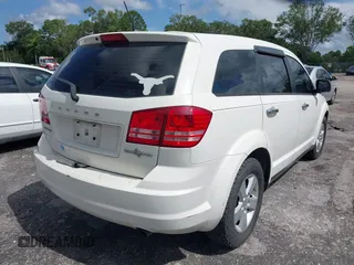 2013 Dodge Journey Canada Value z VIN 3C4PDCAB1DT646810, wystawiony jako IAAI lot #42484918 z przebiegiem 212 456 mil mil oraz . Historia ofert i sprzedaży dostępna na DreamBid. Obrazek 4.