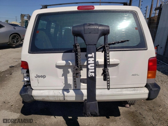 1999 Jeep Cherokee Sport with VIN 1J4FT68S9XL627003, listed as a Copart auction lot 49478595 with 320,444 mi miles and Salvage Title. Bid and sale history available at carsss.com. Image 6.