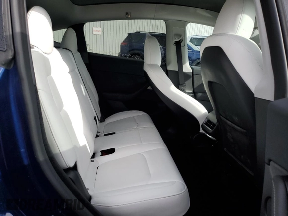 2024 Tesla Model Y Long Range с VIN 7SAYGDEE5RF983771, выставлен на аукционе Copart как лот 86153274 с пробегом 4 105 миль миль и Списание • Salvage title. История ставок и продаж доступна на DreamBid. Изображение 11.
