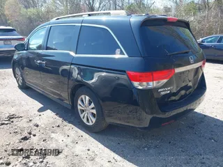 2014 Honda Odyssey EX-L with VIN 5FNRL5H68EB102286, listed as a IAAI auction lot 42148323 with 160,446 mi miles and . Bid and sale history available at carsss.com. Image 3.