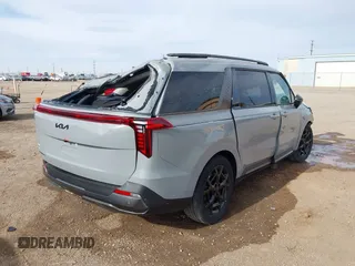 2025 Kia Carnival SX with VIN KNDNE5K33S6497315, listed as a IAAI auction lot 41133179 with 3,063 mi miles and . Bid and sale history available at DreamBid. Image 4.
