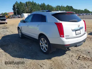2013 Cadillac SRX Performance Collection with VIN 3GYFNHE31DS597987, listed as a IAAI auction lot 42319058 with 139,670 mi miles and . Bid and sale history available at DreamBid. Image 3.