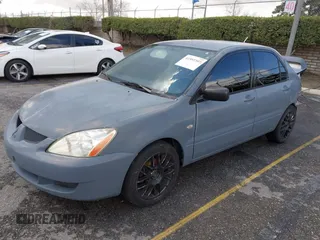 2004 Mitsubishi Lancer ES with VIN JA3AJ26E54U054570, listed as a IAAI auction lot 41592397 with 220,140 mi miles. Bid and sale history available at carsss.com. Image 2.