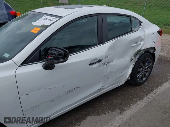 2018 Mazda 3 Touring with VIN 3MZBN1V32JM190611, listed as a IAAI auction lot 42032844 with 63,493 mi miles and . Bid and sale history available at DreamBid. Image 6.