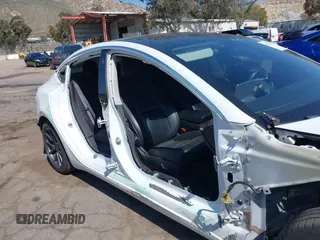 2018 Tesla Model 3 Long Range Battery with VIN 5YJ3E1EAXJF108781, listed as a IAAI auction lot 41962628 with 61,208 mi miles and . Bid and sale history available at DreamBid. Image 6.