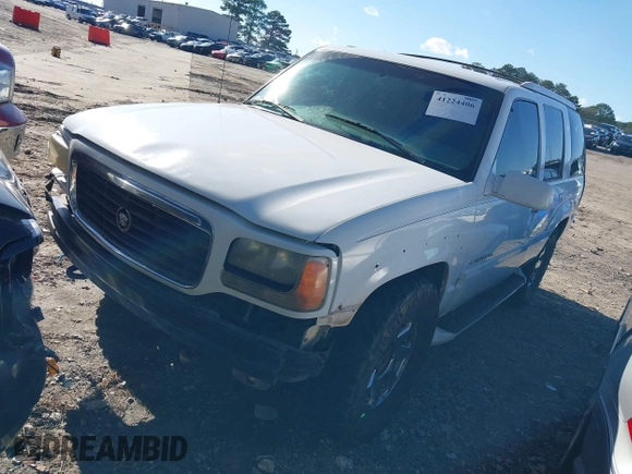 2000 Cadillac Escalade z VIN 1GYEK63R7YR226034, wystawiony jako IAAI lot #41224406 z przebiegiem 293 123 mil mil oraz . Historia ofert i sprzedaży dostępna na DreamBid. Obrazek 2.