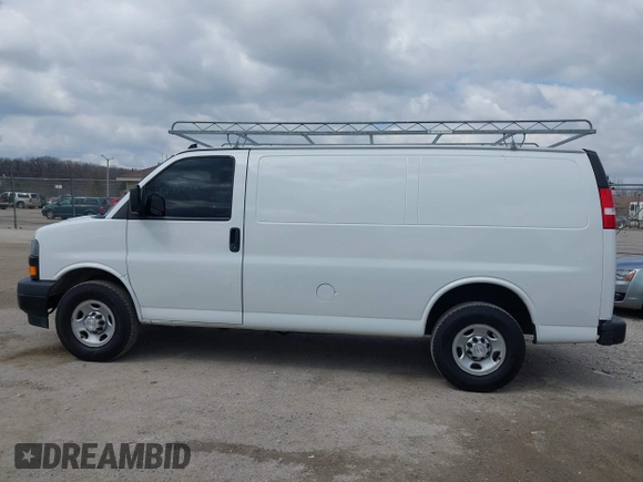 2018 Chevrolet Express Cargo Van with VIN 1GCWGAFP6J1336229, listed as a IAAI auction lot 42022722 with 99,005 mi miles. Bid and sale history available at carsss.com. Image 14.