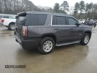 2015 GMC Yukon SLT with VIN 1GKS1BKC9FR278056, listed as a Copart auction lot 44989505 with 205,885 mi miles and Salvage Title. Bid and sale history available at carsss.com. Image 3.