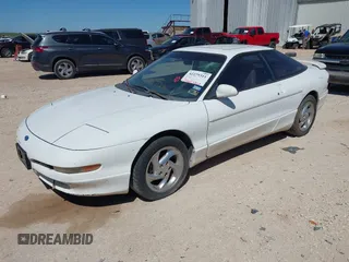 1996 Ford Probe z VIN 1ZVLT22B0T5127219, wystawiony jako IAAI lot #42279311 z przebiegiem 123 290 mil mil oraz . Historia ofert i sprzedaży dostępna na DreamBid. Obrazek 2.