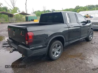 2021 Honda Ridgeline RTL-E with VIN 5FPYK3F75MB015370, listed as a IAAI auction lot 42253586 with 84,188 mi miles and . Bid and sale history available at DreamBid. Image 4.