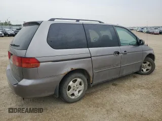 2000 Honda Odyssey EX z VIN 2HKRL186XYH010384, wystawiony jako Copart lot #60871845 z przebiegiem 423 167 mil mil oraz Czysty tytuł • Clean title. Historia ofert i sprzedaży dostępna na DreamBid. Obrazek 3.