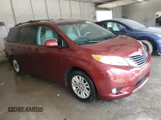 2011 Toyota Sienna XLE AAS with VIN 5TDYK3DC8BS024209, listed as a Copart auction lot 58923715 with 134,051 mi miles and Salvage title. Bid and sale history available at DreamBid. Image 4.