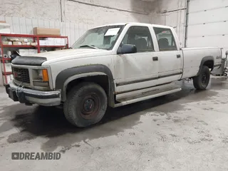 1997 GMC Sierra 3500 z VIN 1GTHK33F4VF004765, wystawiony jako IAAI lot #42053137 z przebiegiem 129 249 mil mil oraz . Historia ofert i sprzedaży dostępna na DreamBid. Obrazek 2.