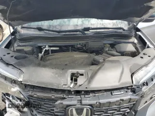 2019 Honda Passport EX-L z VIN 5FNYF8H5XKB019773, wystawiony jako Copart lot #56115105 z przebiegiem 92 885 mil mil oraz Szkody całkowita. Historia ofert i sprzedaży dostępna na DreamBid. Obrazek 12.