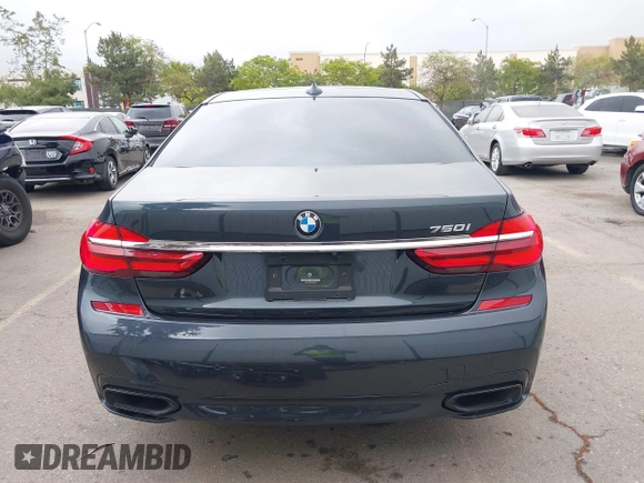 2019 BMW 7 Series 750i with VIN WBA7F0C50KGM26010, listed as a IAAI auction lot 42188421 with 71,576 mi miles and . Bid and sale history available at DreamBid. Image 17.