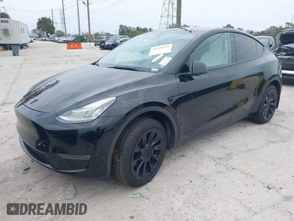 2021 Tesla Model Y Standard Range with VIN 5YJYGDED8MF123246, listed as a IAAI auction lot 41291676 with 74,630 mi miles and . Bid and sale history available at DreamBid. Image 2.