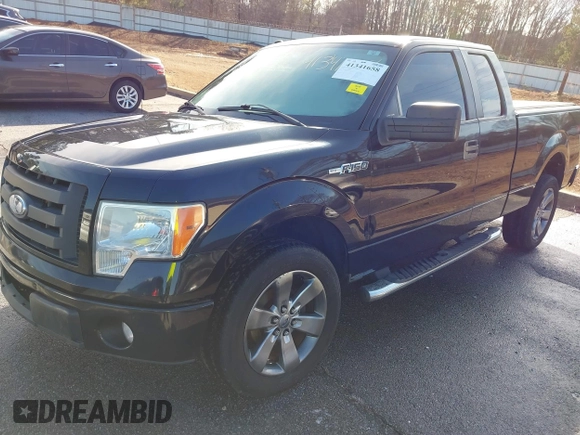 2009 Ford F-150 STX with VIN 1FTRX12WX9FA69251, listed as a IAAI auction lot 41341658 with 169,074 mi miles. Bid and sale history available at carsss.com. Image 2.