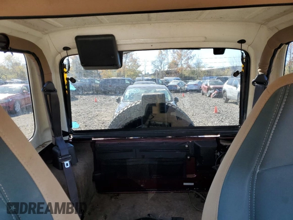 2002 Jeep Wrangler Sahara with VIN 1J4FA59S22P704603, listed as a Copart auction lot 77554334 with 99,758 mi miles and Salvage Title. Bid and sale history available at carsss.com. Image 10.