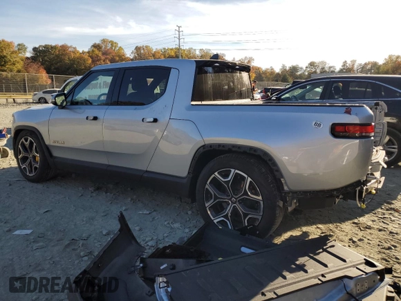 2022 Rivian R1T Launch Edition z VIN 7FCTGAAL6NN002704, wystawiony jako Copart lot #77913144 z przebiegiem 40 665 mil mil oraz Szkoda całkowita • Salvage title. Historia ofert i sprzedaży dostępna na DreamBid. Obrazek 2.