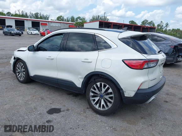 2020 Ford Escape Titanium Hybrid with VIN 1FMCU0DZ3LUC07842, listed as a IAAI auction lot 42456359 with 62,756 mi miles and . Bid and sale history available at DreamBid. Image 3.