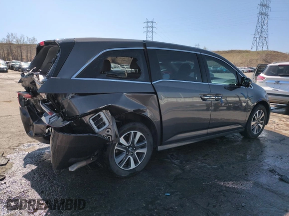 2014 Honda Odyssey Touring with VIN 5FNRL5H95EB052523, listed as a Copart auction lot 52214055 with 131,350 mi miles and Salvage Title. Bid and sale history available at DreamBid. Image 3.