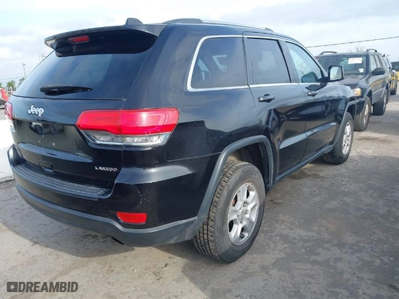 2014 Jeep Grand Cherokee Laredo with VIN 1C4RJFAG9EC516138, listed as a IAAI auction lot 42055214 with 135,701 mi miles. Bid and sale history available at carsss.com. Image 4.