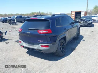 2015 Jeep Cherokee Trailhawk z VIN 1C4PJMBS3FW520829, wystawiony jako IAAI lot #42065548 z przebiegiem 90 534 mil mil oraz . Historia ofert i sprzedaży dostępna na DreamBid. Obrazek 4.