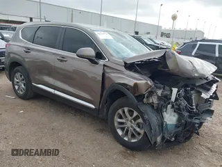 2019 Hyundai Santa Fe SE z VIN 5NMS23AD2KH014037, wystawiony jako IAAI lot #42110778 z przebiegiem 48 975 mil mil oraz . Historia ofert i sprzedaży dostępna na DreamBid. Obrazek 1.