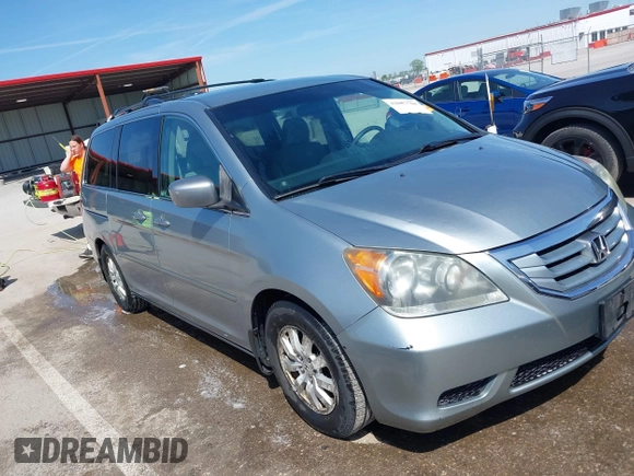 2010 Honda Odyssey EX with VIN 5FNRL3H44AB059711, listed as a IAAI auction lot 42057760 with 225,486 mi miles and . Bid and sale history available at DreamBid. Image 1.