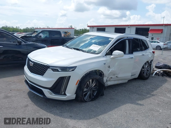 2020 Cadillac XT6 FWD Premium Luxury with VIN 1GYKPCRS6LZ193579, listed as a IAAI auction lot 42367917 with 39,647 mi miles and . Bid and sale history available at DreamBid. Image 2.