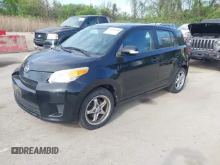 2009 Scion xD with VIN JTKKU10409J041654, listed as a IAAI auction lot 42036558 with 122,661 mi miles. Bid and sale history available at carsss.com. Image 2.