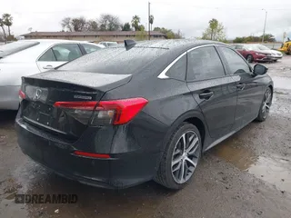 2022 Honda Civic Sedan Touring with VIN 2HGFE1F93NH302409, listed as a IAAI auction lot 41719494 with 34,129 mi miles. Bid and sale history available at carsss.com. Image 4.