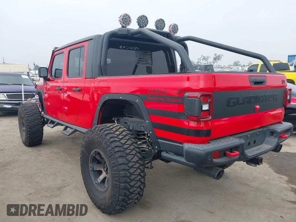 2020 Jeep Gladiator Rubicon with VIN 1C6JJTBG4LL178260, listed as a IAAI auction lot 42602460 with 61,899 mi miles and . Bid and sale history available at DreamBid. Image 3.
