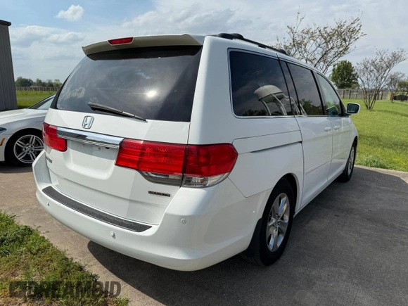 2010 Honda Odyssey Touring with VIN 5FNRL3H94AB047330, listed as a Copart auction lot 54064195 with 193,979 mi miles and Clean Title. Bid and sale history available at carsss.com. Image 4.