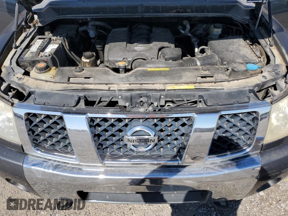 2005 Nissan Titan LE with VIN 1N6BA07B95N571880, listed as a Copart auction lot 57527435 with 199,577 mi miles and Salvage title. Bid and sale history available at DreamBid. Image 11.