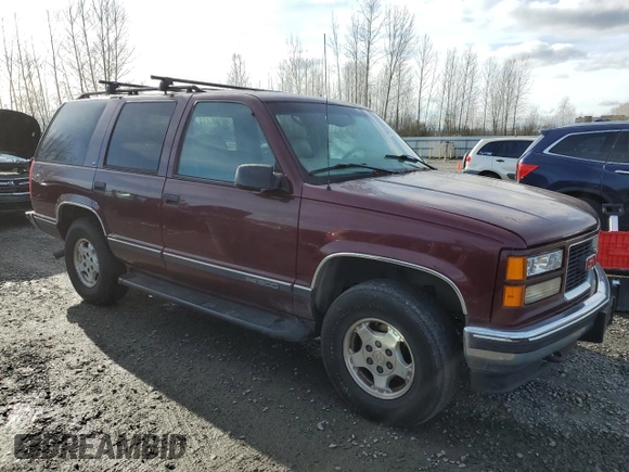 1998 GMC Yukon with VIN 1GKEK13R4WJ719517, listed as a Copart auction lot 44651715 with 230,062 mi miles and Clean Title. Bid and sale history available at carsss.com. Image 4.